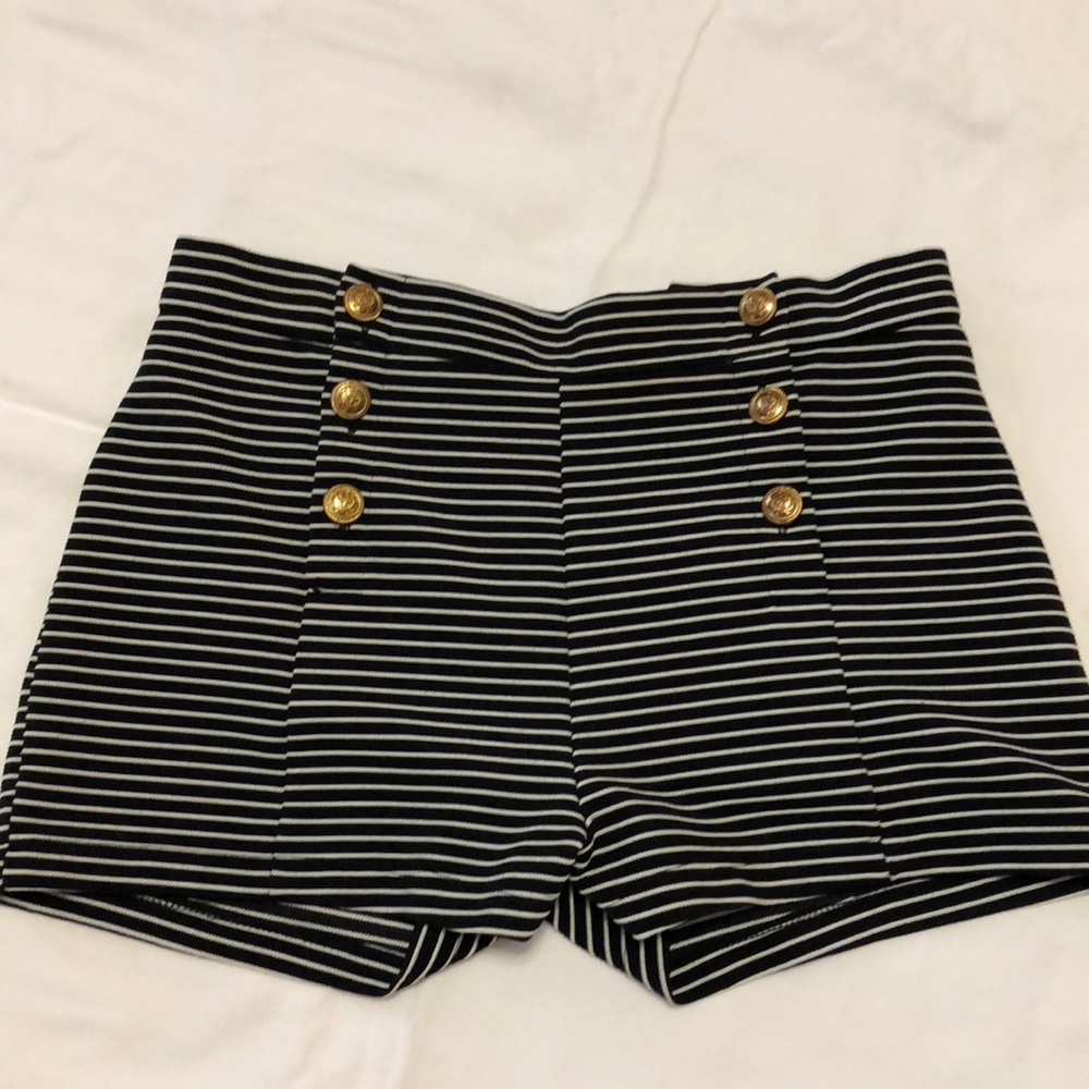 black and white striped shorts with gold buttons